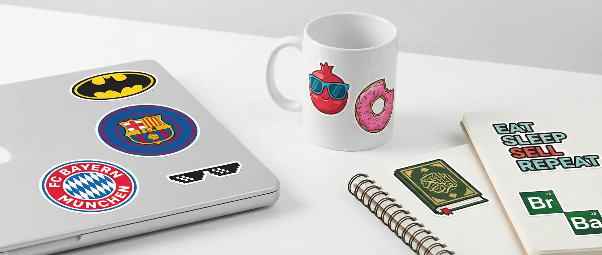 White ceramic mug featuring a pomegranate wearing sunglasses and a pink donut with colorful cartoon decals